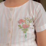 front view showing embroidery and button opening
