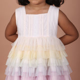Close-up of pleated bodice and rainbow layered skirt detailing on girls dress