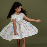 girl wearing pink bow embroidered schiffli dress