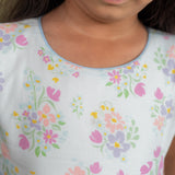 front view showing scallop waistline and schiffli skirt