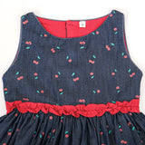 Close-up front bodice view of cherry print denim dress for girls