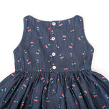 Back view of denim cherry dress with button closure