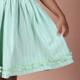 Close-up view of ruffle details on hemline