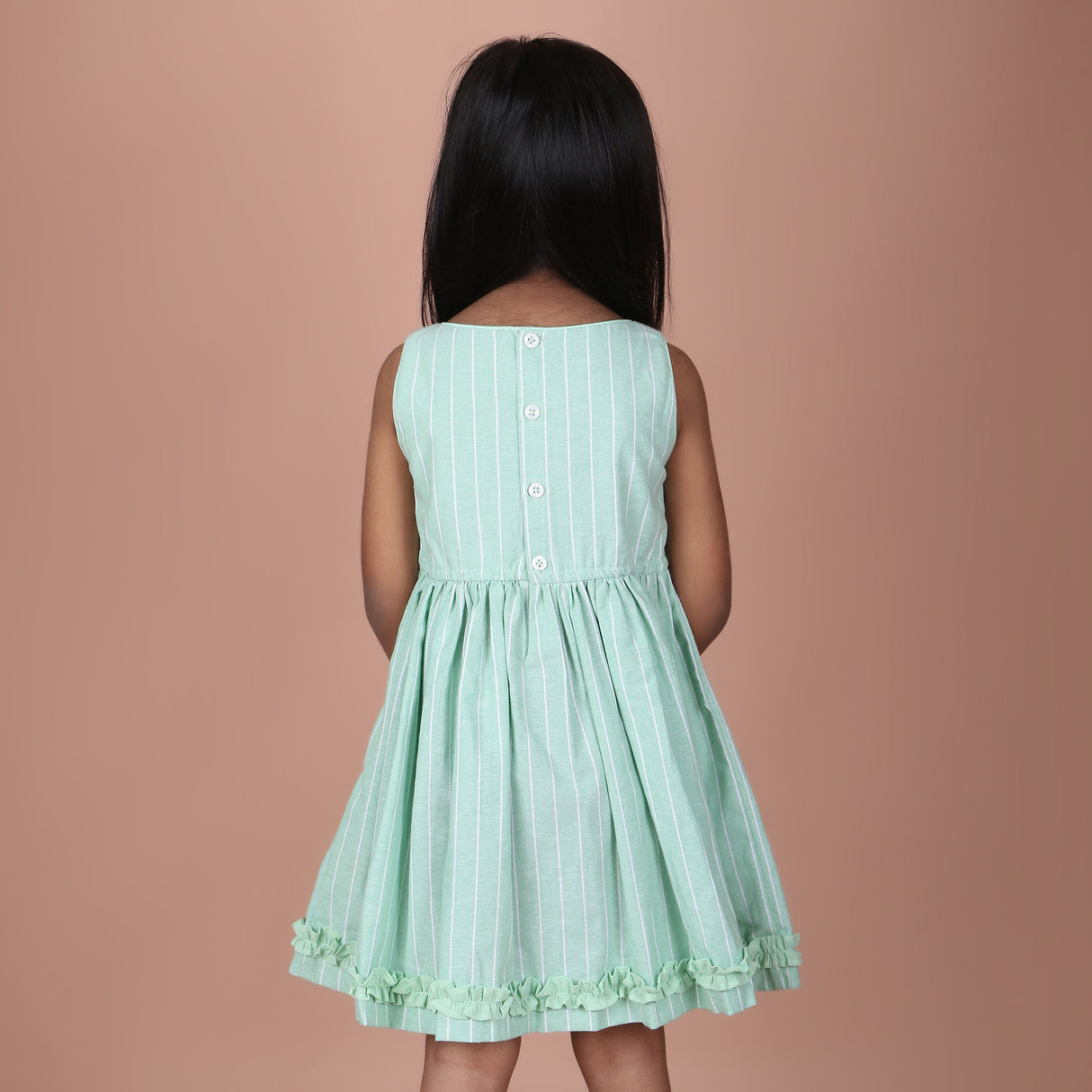 Back view of mint green sleeveless dress with back button closure