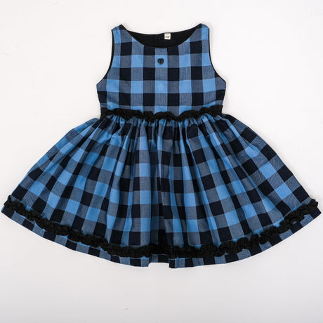 Front view of blue and black check with ruffle detailings
