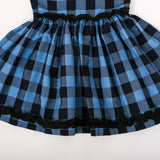 Close-up of gathered skirt with ruffle details on waist and hemline