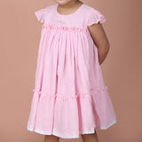 front view showing ruffle details and lace trim hem