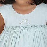 close-up of rose embroidery on bodice