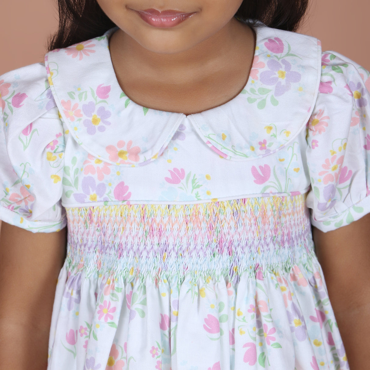 close-up of rainbow hand smocked detail