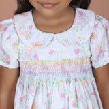 close-up of rainbow hand smocked detail