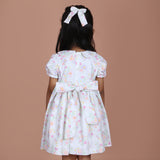 back view showing button closure and waist ties
