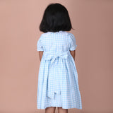 back view showing button closure and waist ties