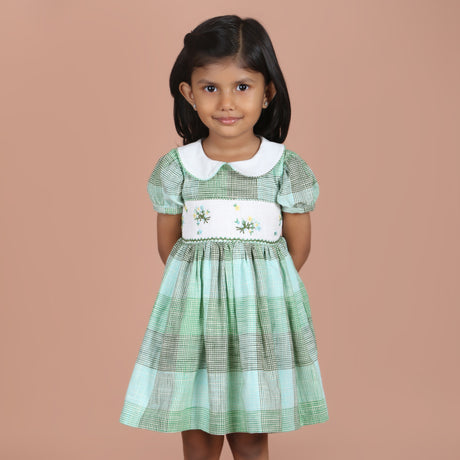 Front view of green check embroidered girls dress with Peter Pan collar