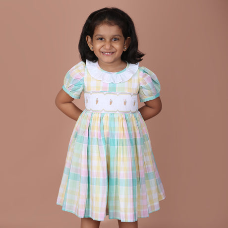Front view of pastel plaid icecream embroidered smock girls dress
