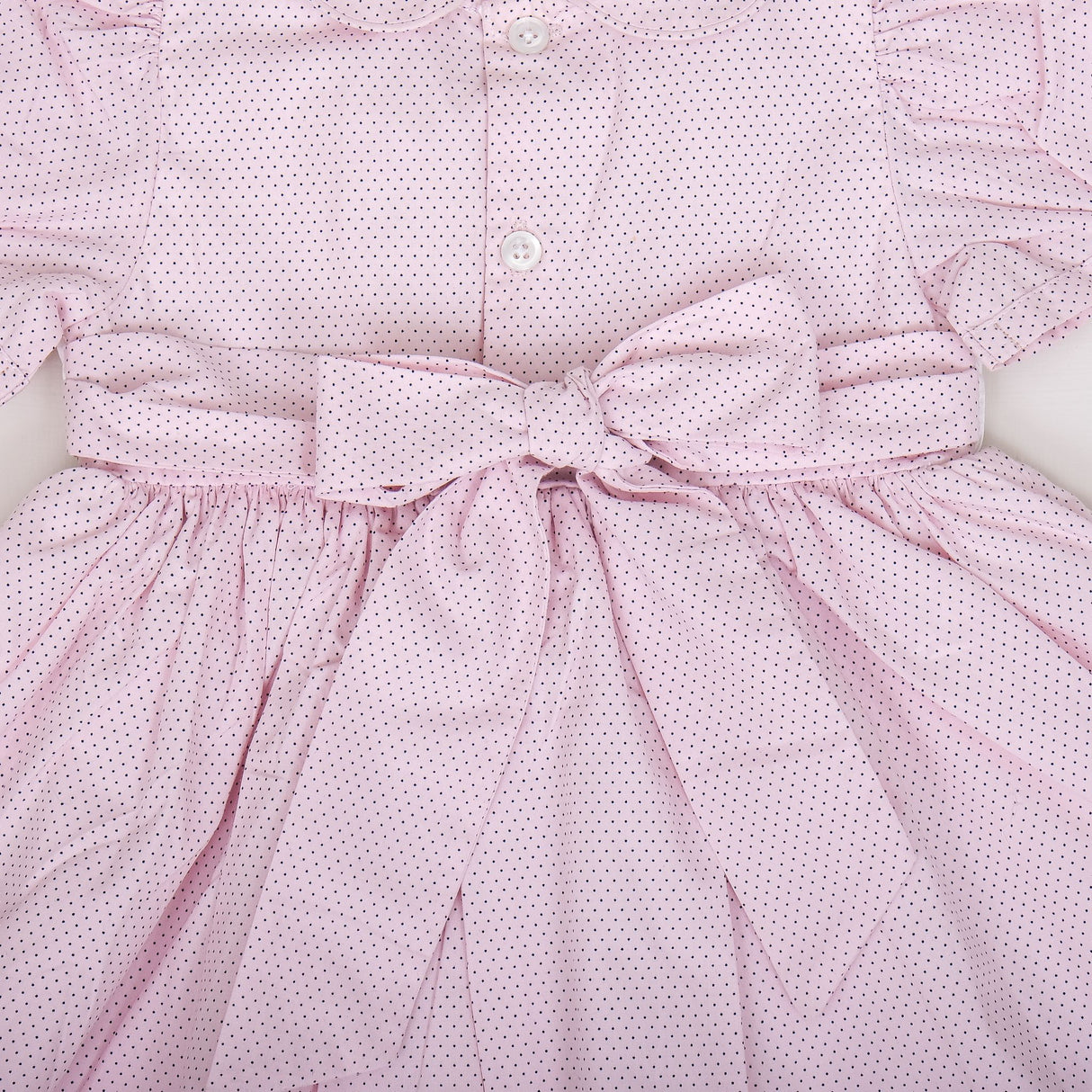 close-up of back button closure and waist ties