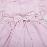 close-up of back button closure and waist ties