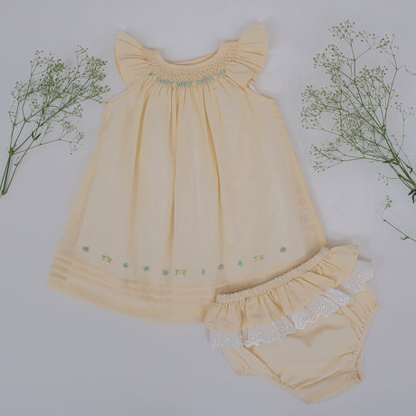 Front flat lay view of yellow hand smocked baby dress with matching bloomers