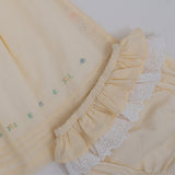 Yellow baby dress with gathered skirt and embroidered detailing