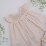 Front upper view of flutter sleeve hand smocked girls dress