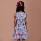 back view of blue floral girls dress with tie-up bow detail