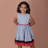 navy ditsy floral girls dress with red waistband, angled view