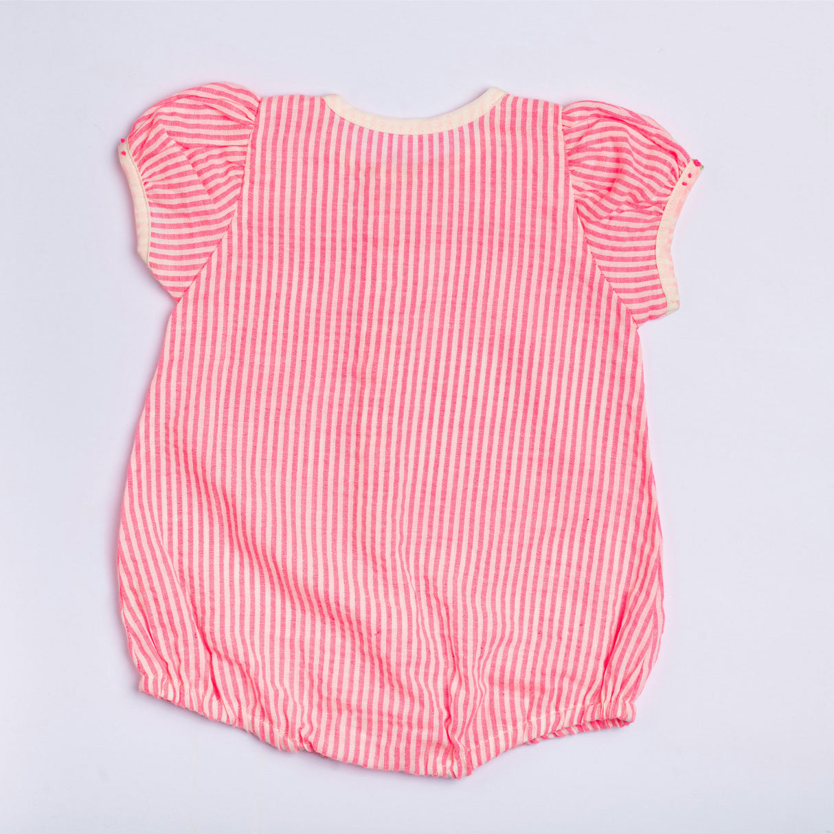 Rear image of the neon pink striped cotton onesie