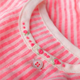neon stripe onesie close up with neon hand embroidered roses