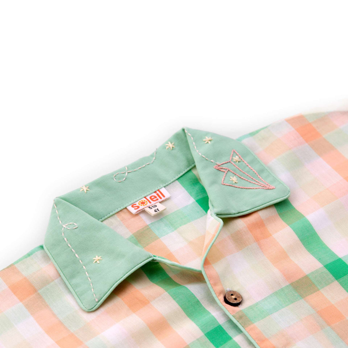 Close-up of the hand embroidered collar in orange and green checked pyjama set