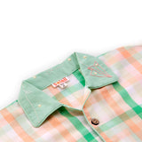 Close-up of the hand embroidered collar in orange and green checked pyjama set