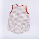 Rear image of white cotton printed onesie with contrast piping