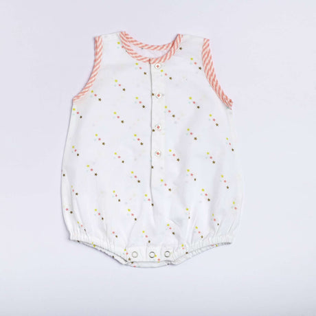 Flatlay of star print onesie with neon pink stripe piping, front open placket and button fastening