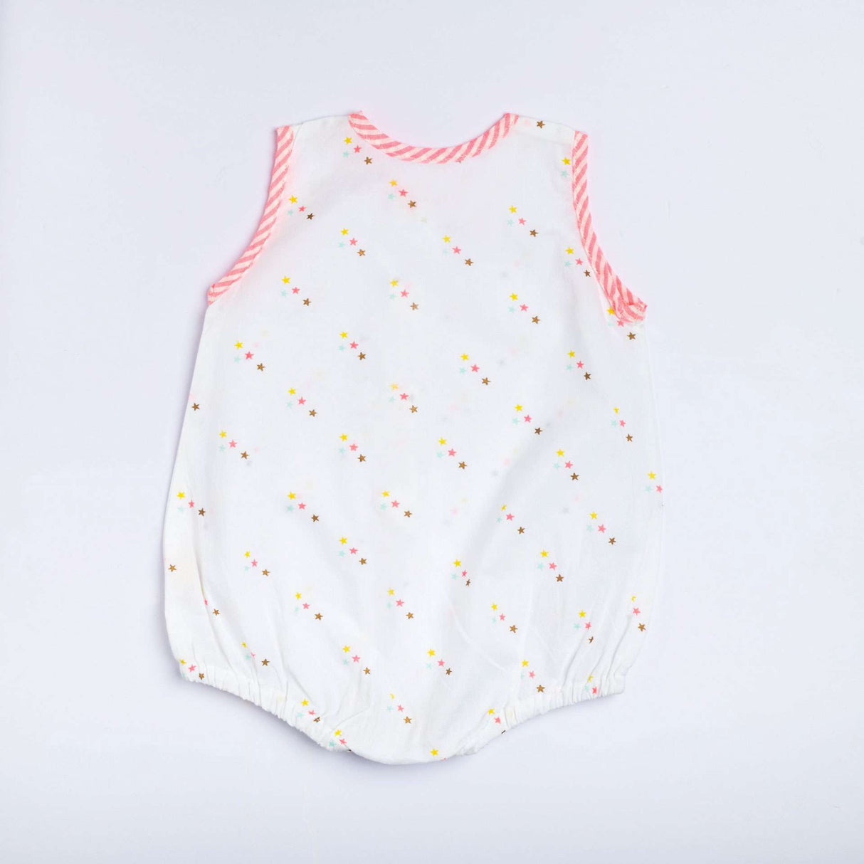 Back view of infant sleeveless romper with pink stripe piping and stars printed on a white base