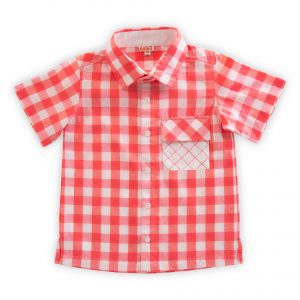 Flatlay of coral checked shirt with a front open placket and a white pocket hand embroidered in tones of coral
