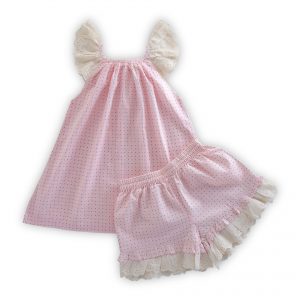 Flatlay of pink dotted tunic with lace cap sleeves paired with matching bloomers with gentle waist and leg elastication