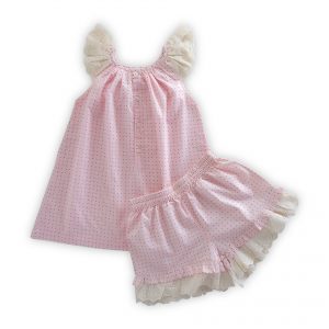 Flatlay of rear side of pink dotted tunic with lace cap sleeves and matching bloomers with waist and leg elastication
