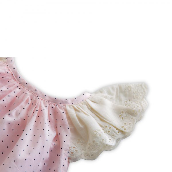 Close-up of night wear set featuring a tunic with lace cap sleeves paired with matching bloomers
