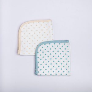 Flatlay of infant block print wipes with contrast piping