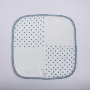 Hand block printed white gauze baby wipe with teal blue dot prints and teal piping