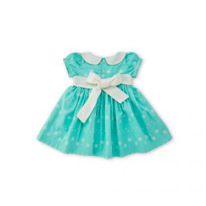Rear image of mint blue scallop dress with hand embroidered scallop collar and extendable hem