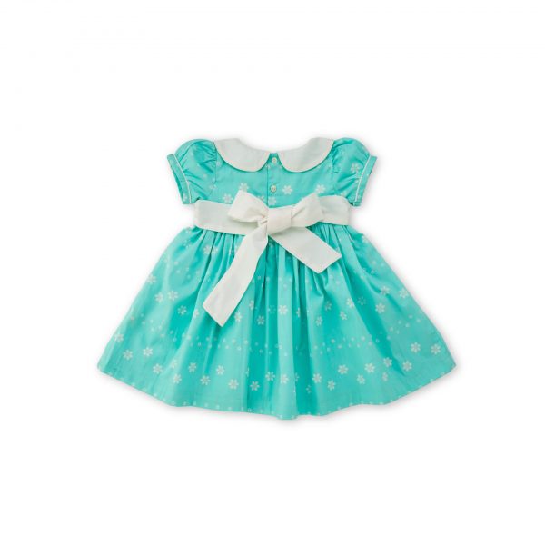 Rear image of mint blue scallop dress with hand embroidered scallop collar and extendable hem