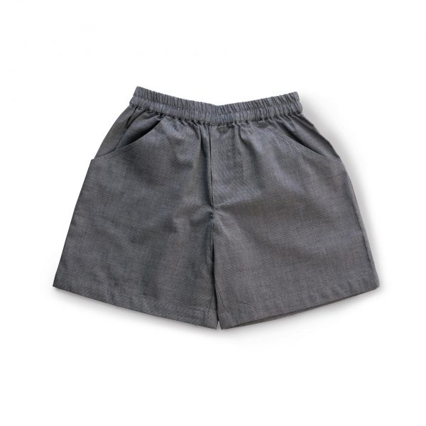 Flatlay of grey cotton chambray shorts featuring a cute hand-embroidered motif on the back pocket