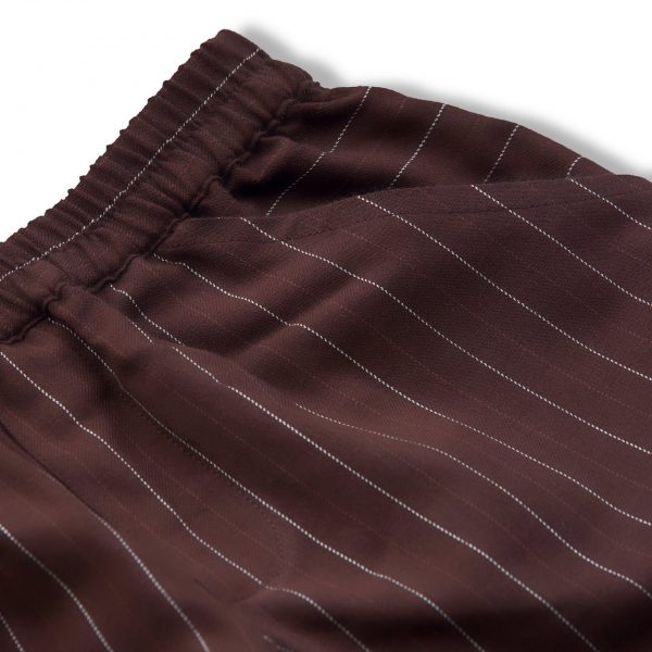 Close up of brown and white striped shorts with side pockets and back pocket