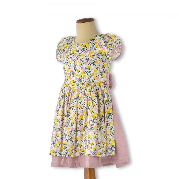 Mannequin shot of ivory floral double skirt dress with skirt undelay in dusty pink