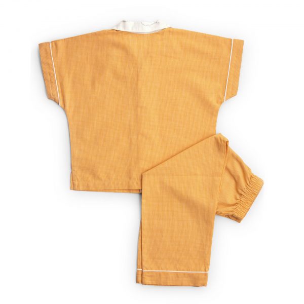 Flatlay of rear side of cozy orange pyjama set with an open collar shirt and straight fit pants with elasticated waist