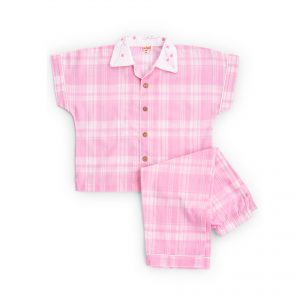 Flatlay of pink pyjama set with hand embroidered open collar shirt and straight fit pants with an elasticated waistbanda