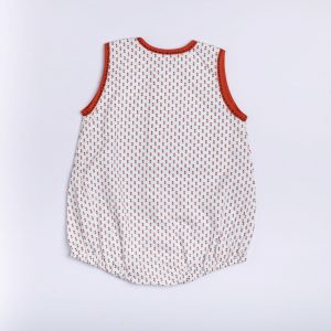 Rear image of white cotton printed onesie with contrast piping