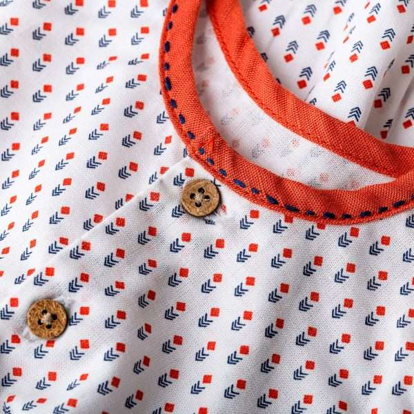 Neckline with orange piping and navy kantha stitching
