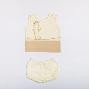 Flatlay of tan dual-tone hand embroidered baby vest and diaper cover set