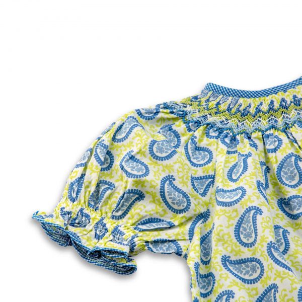 Close-up of green and blue Indian mango print bishop dress with hand smocked neckline, waist belt, and blue gingham trims
