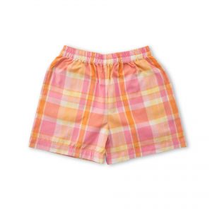 Flatlay of pink plaid shorts with a dainty hand embroidered yellow pocket